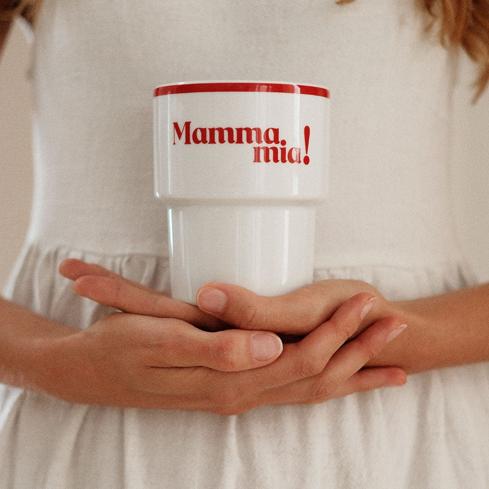 bold mamma mia ceramic mug with sicilian 50s design on a rustic table