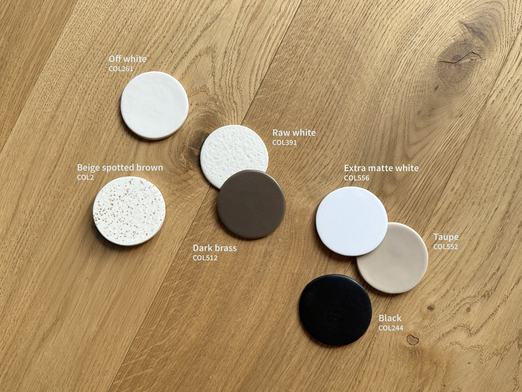 elegant matte white ceramic wall light casting a soft, refined glow in a sophisticated interior