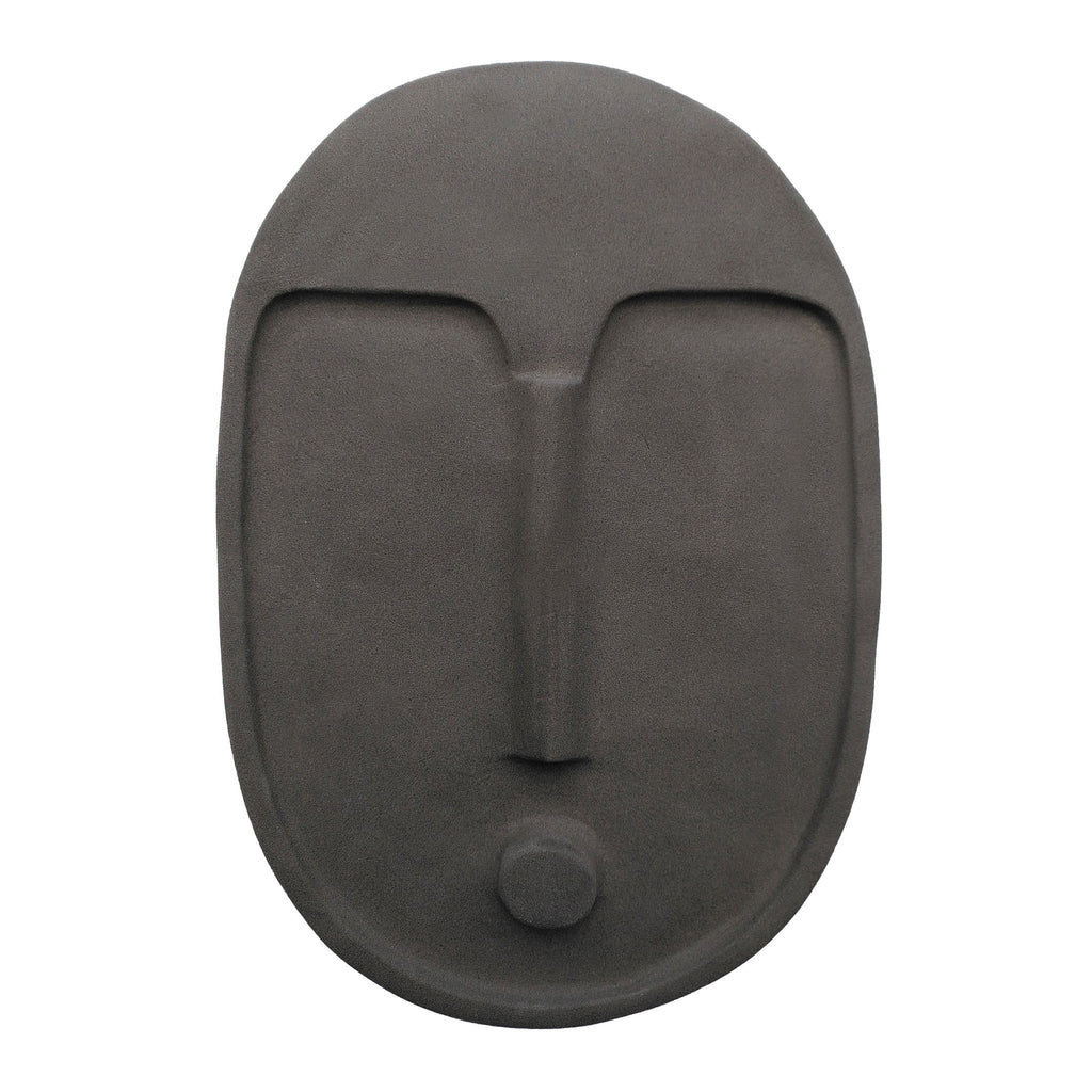 elegant anthracite grey ceramic wall mask with textured terracotta glaze, lit softly in a modern living room