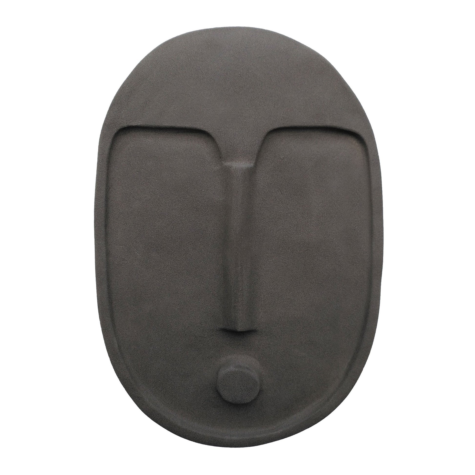 elegant anthracite grey ceramic wall mask with textured terracotta glaze, lit softly in a modern living room