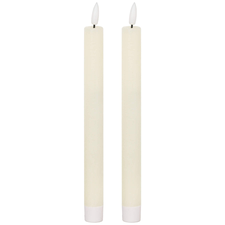 Elegant ivory LED dinner candle with warm flickering glow, flameless and smokeless, 25cm tall for stylish table decor by Sostter at brixbailey.com