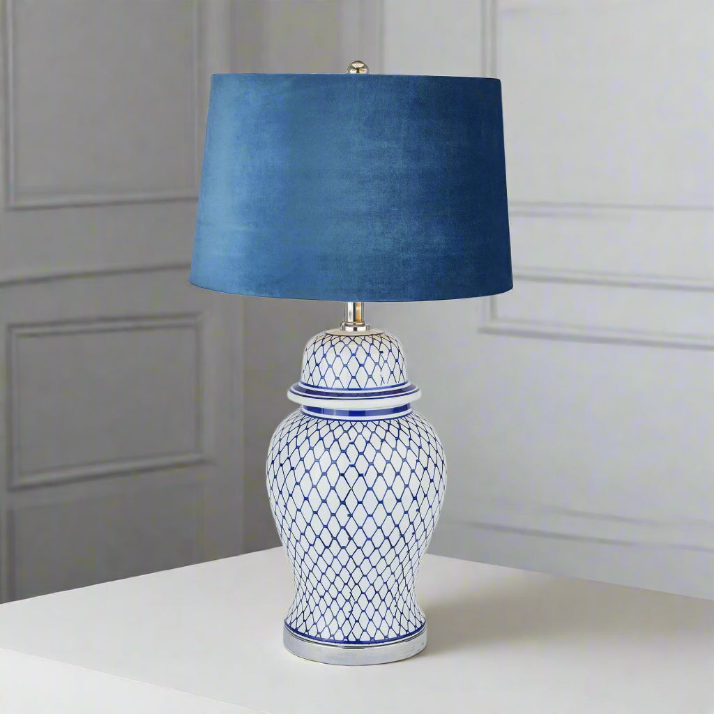 Blue and white ceramic ginger jar lamp with hand-painted motifs and plush velvet shade, 76cm tall   

âœ… **Keywords included:** ceramic, ginger jar lamp, blue and white, hand-painted, velvet shade  
âœ… **Clear description:** Visually details the lampâ€™s materials, colors, and distinctive features  
âœ… **SEO & accessibility optimized:** Concise yet descriptive for both search engines and screen readers by Sostter at brixbailey.com