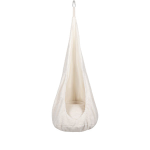 a bold statement in home decor - the textured cocoon swing for kids hangs confidently in a modern room