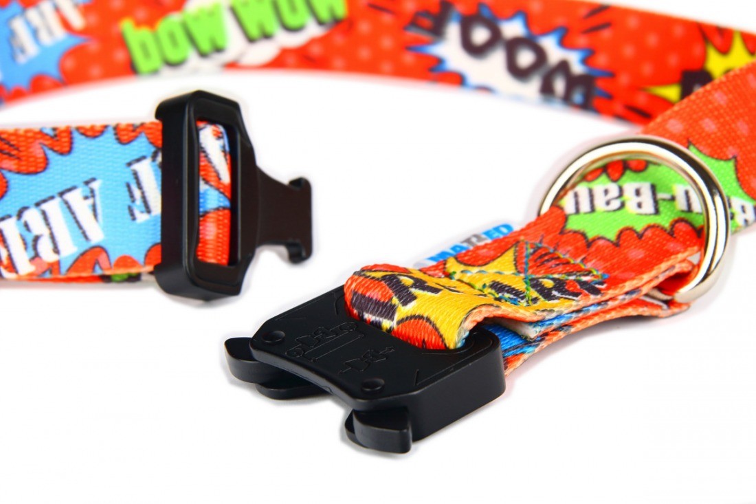 functional red graffiti dog collar with metal buckle shown on a durable woven webbing background
