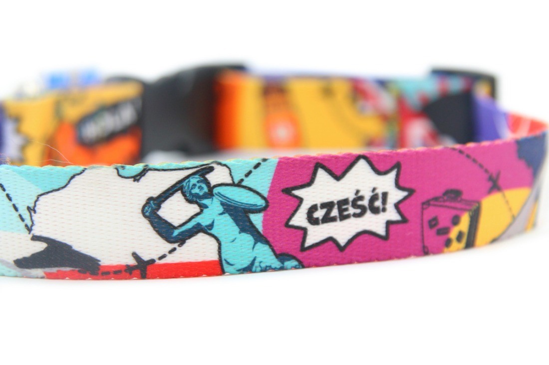 soft woven dog collar with travel landmarks on a cozy fabric background