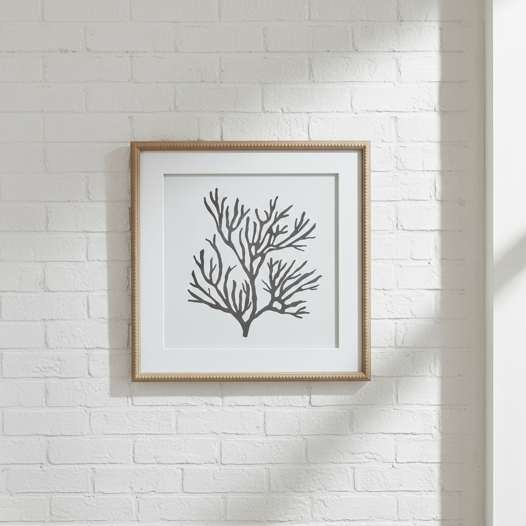 Black coral silhouette artwork on white, framed in natural wood with beaded detailing, 40cm coastal wall decor by sostter at brixbailey.com