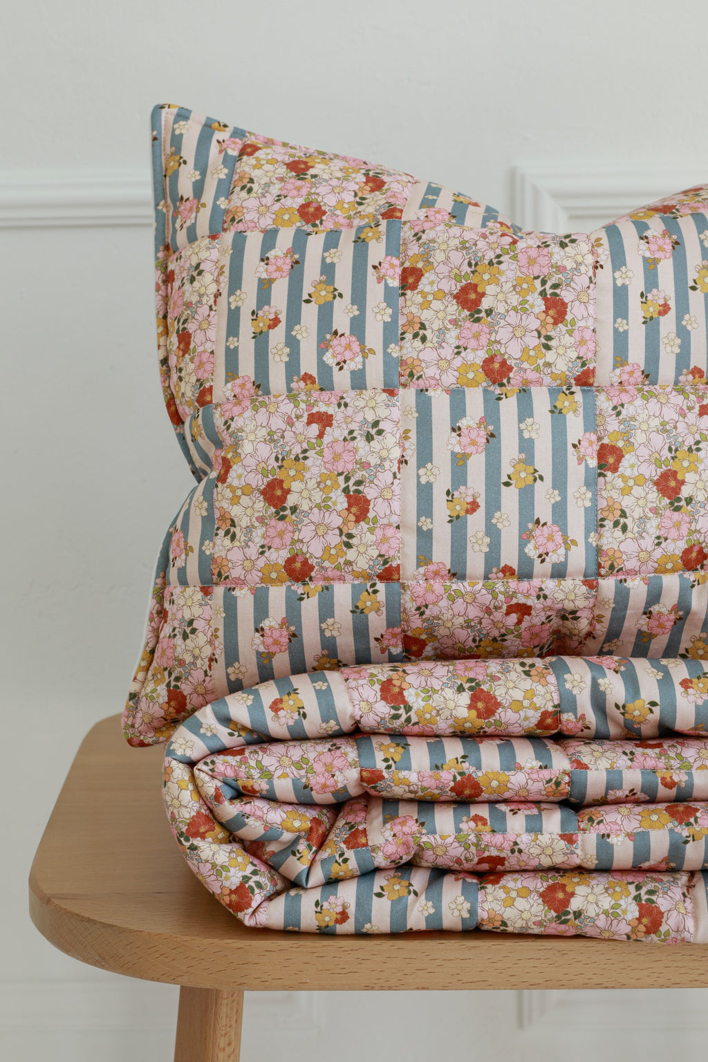bold summer garden cotton quilted blanket and pillow set - vibrant patchwork on neutral background