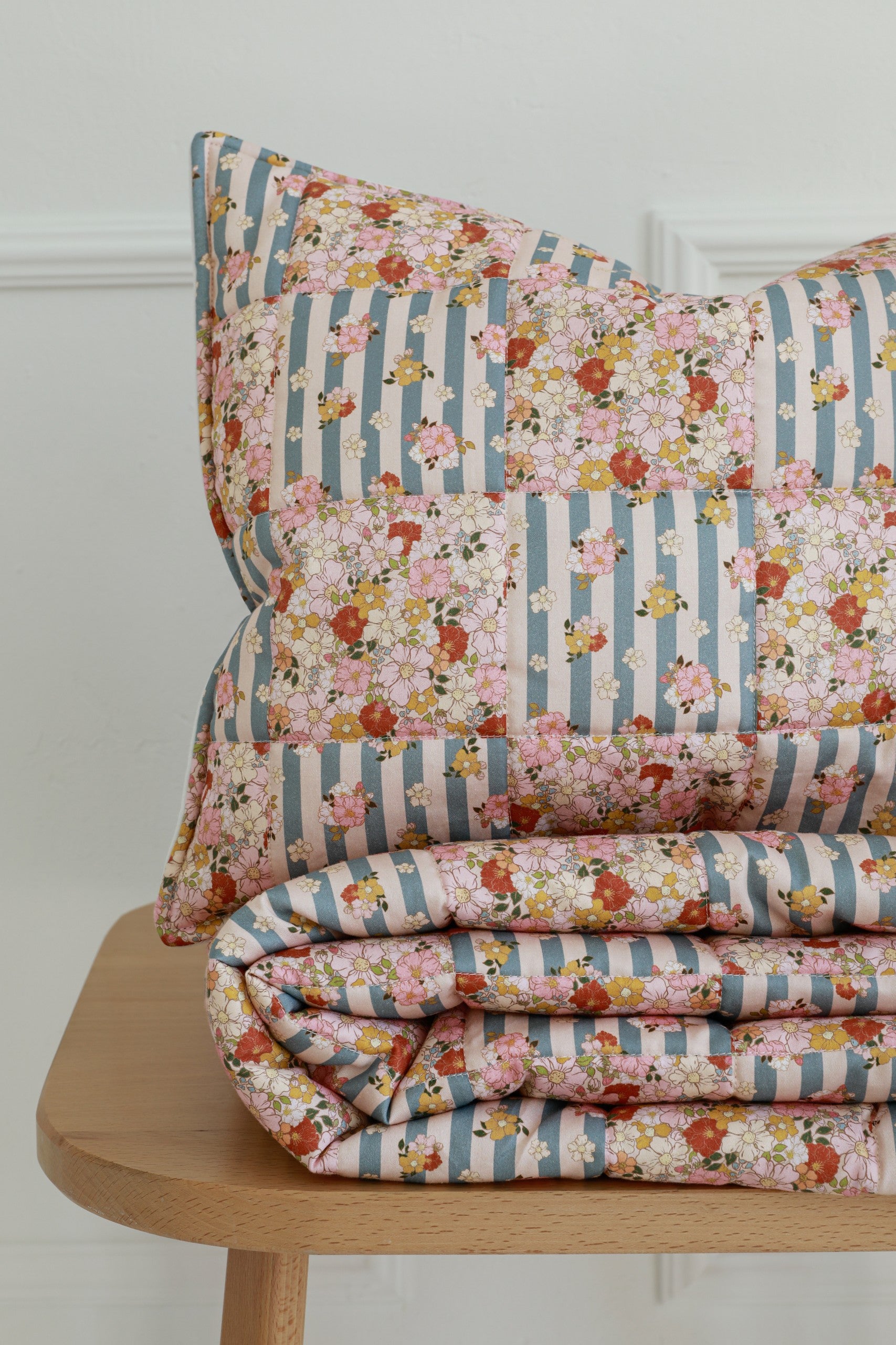 bold summer garden cotton quilted blanket and pillow set - vibrant patchwork on neutral background