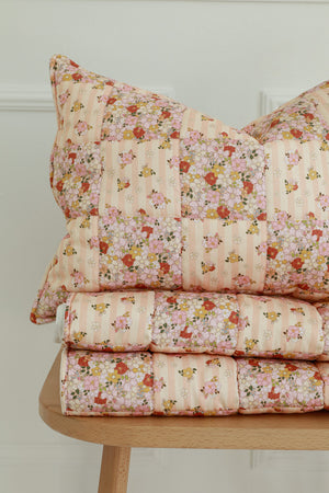 bold spring garden cotton quilted blanket and pillow set - vibrant patchwork on neutral background
