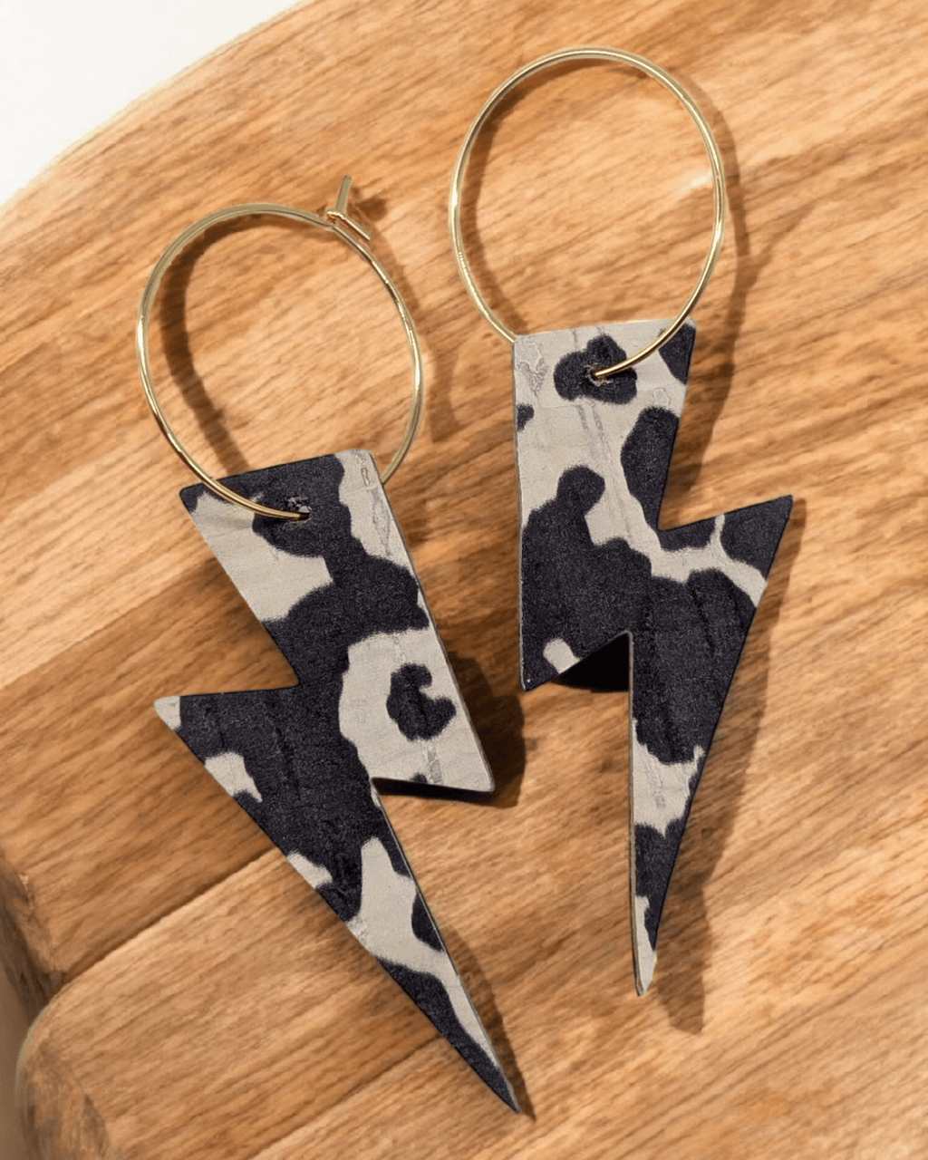 Cow print lightning bolt cork hoop earrings