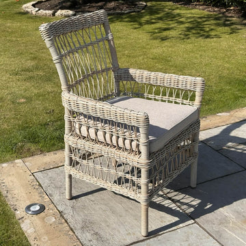 Provence Collection outdoor dining chair in beige, powder-coated aluminum frame with HDPE wicker and Olefin cushions by Sostter at brixbailey.com