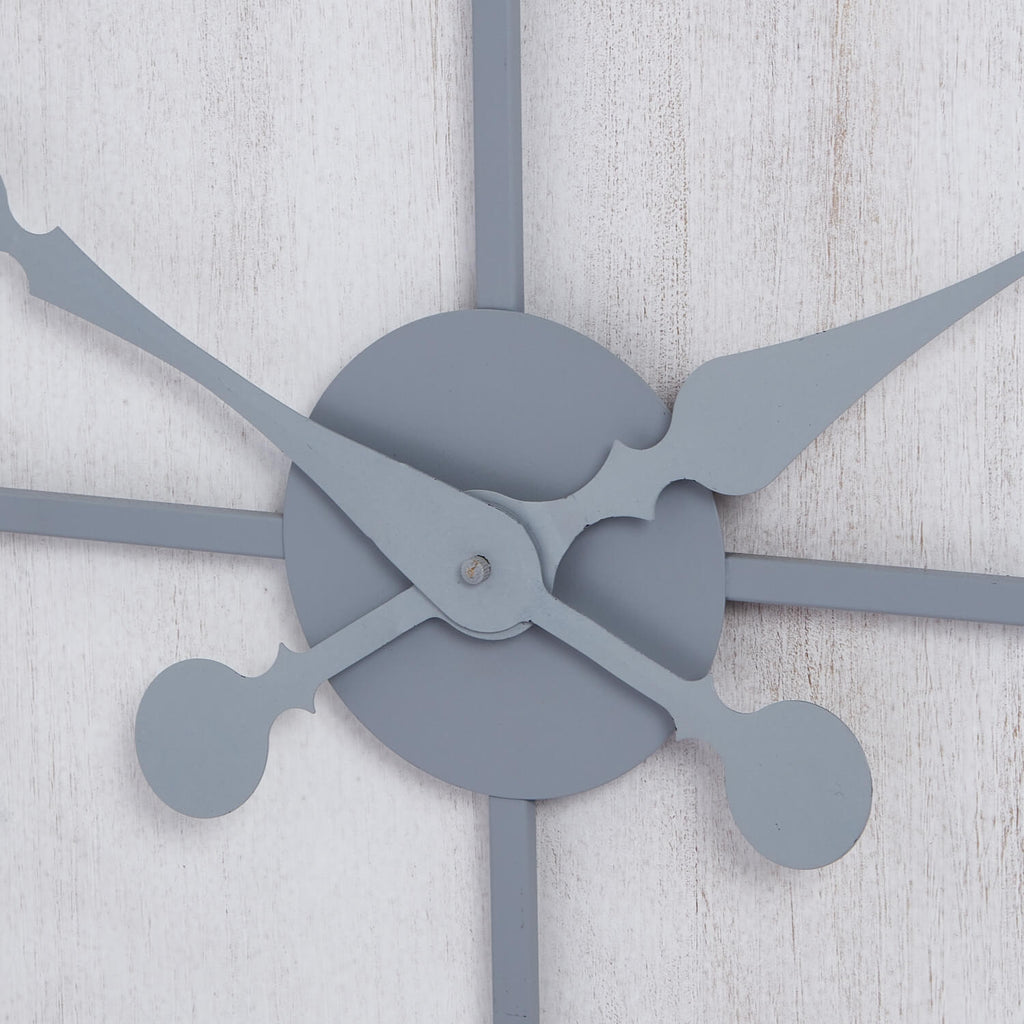 Large silver Roza wall clock with metal panels, modern design, and bold numerals for contemporary interiors by Sostter at brixbailey.com