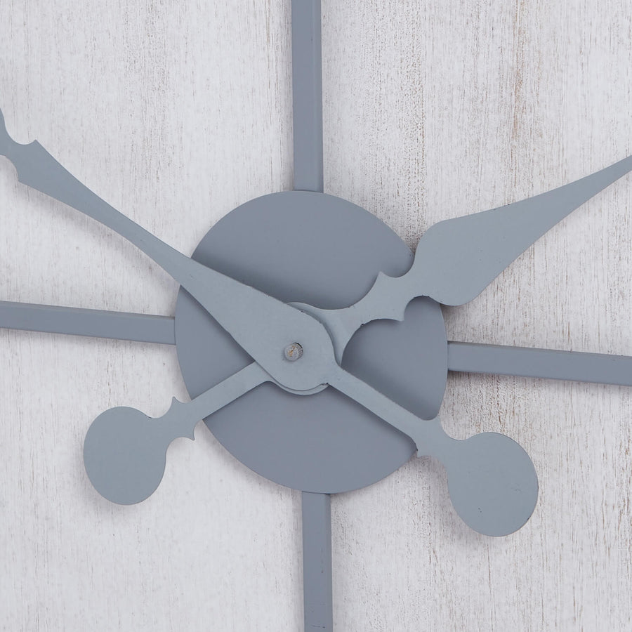 Large silver Roza wall clock with metal panels, modern design, and bold numerals for contemporary interiors by Sostter at brixbailey.com