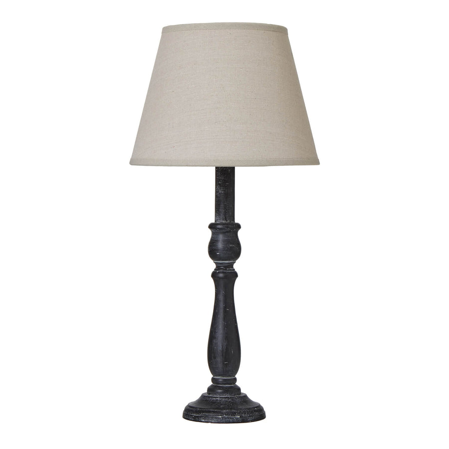 Ravenna Column Table Lamp with distressed black wood base and neutral linen shade â€“ rustic modern home decor lighting by Sostter at brixbailey.com