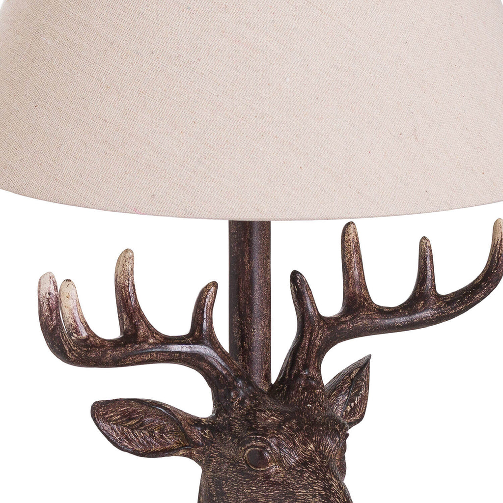 Handcrafted stag head table lamp with bronze resin base and natural linen shade, rustic home decor by Sostter at brixbailey.com