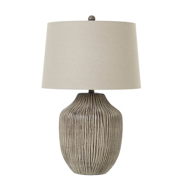Handcrafted ochre table lamp with textured resin base and linen shade, warm earthy glow for rustic or modern decor. by Sostter at brixbailey.com