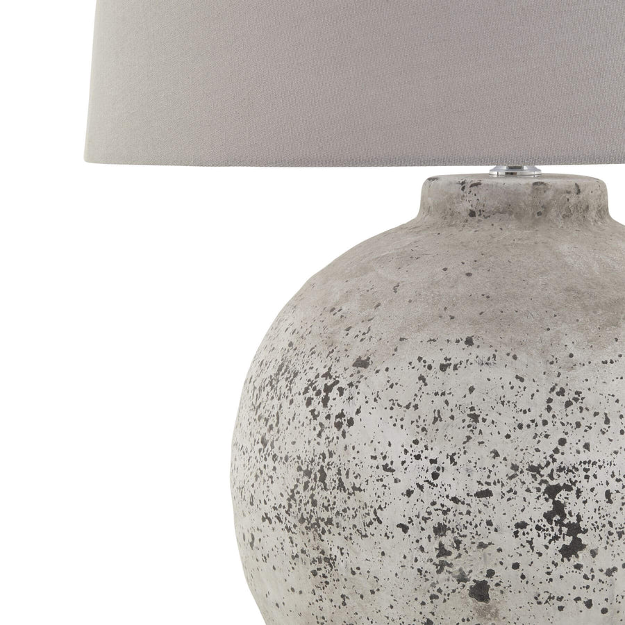 Tiber large stone ceramic lamp with grey fabric shade, artisan-crafted texture, and E14 bulb compatibility for ambient lighting by Sostter at brixbailey.com