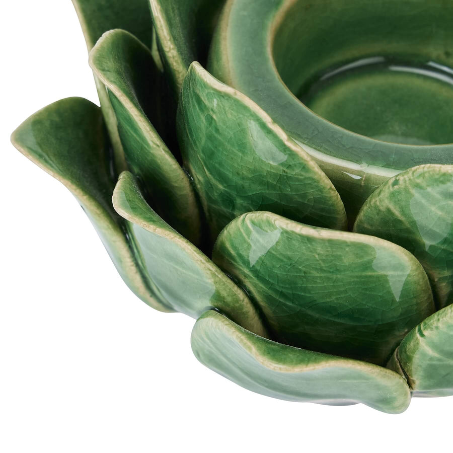 Handcrafted ceramic tea light holder in botanical green with artichoke cutouts, casting intricate shadow patterns. by Sostter at brixbailey.com
