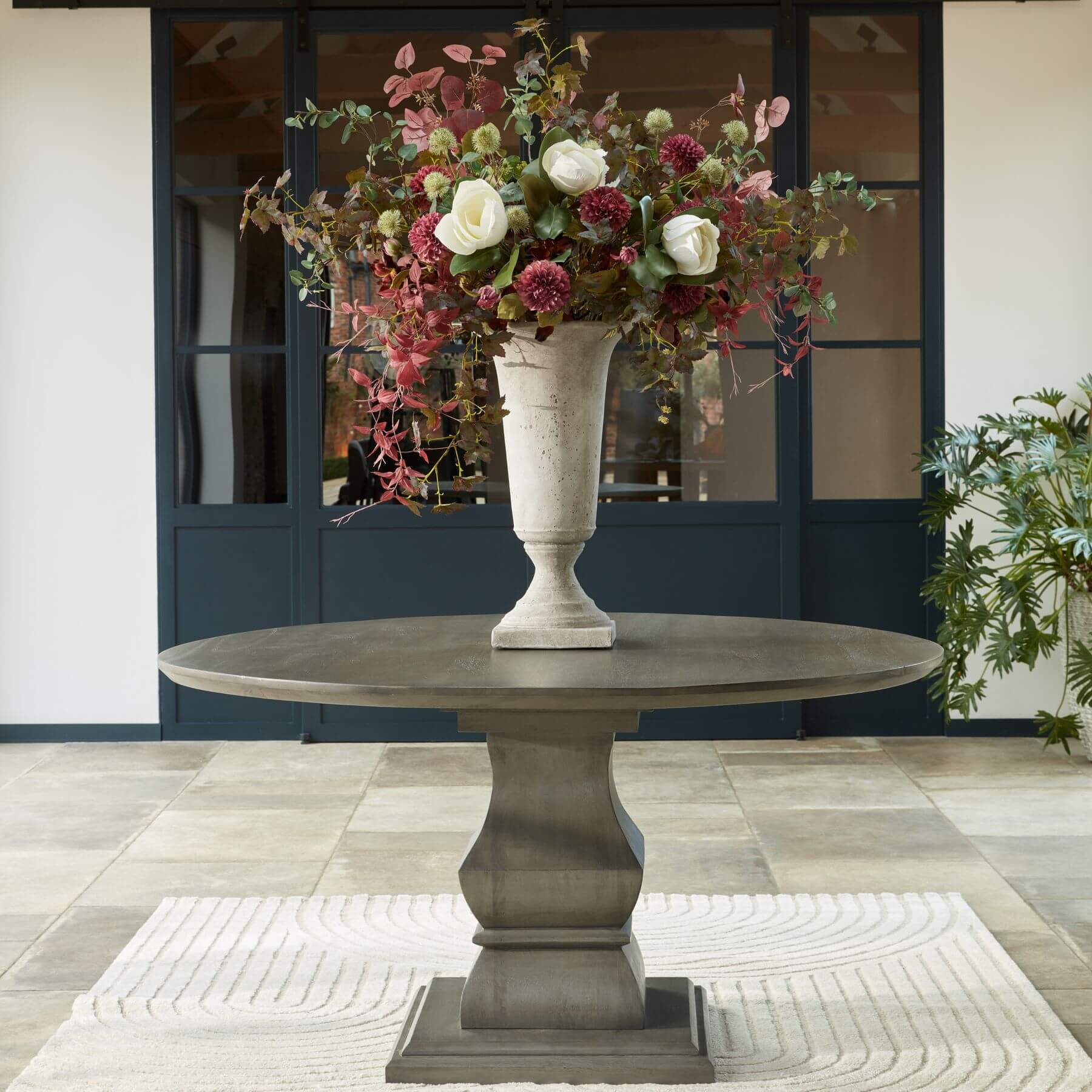 Tall stone-effect ceramic urn planter in neutral tone, 61cm height, for faux floral arrangements or standalone decor by Sostter at brixbailey.com