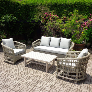 Beige outdoor furniture set with wicker weave, aluminum frame, acacia table, and Olefin cushions for patio or garden by Sostter at brixbailey.com