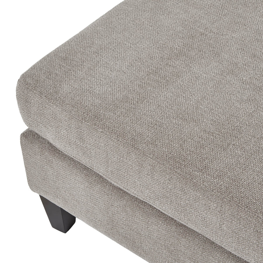 Taupe velvet ottoman foot stool with wooden legs, plush cushioning, and modern farmhouse design by Sostter at brixbailey.com