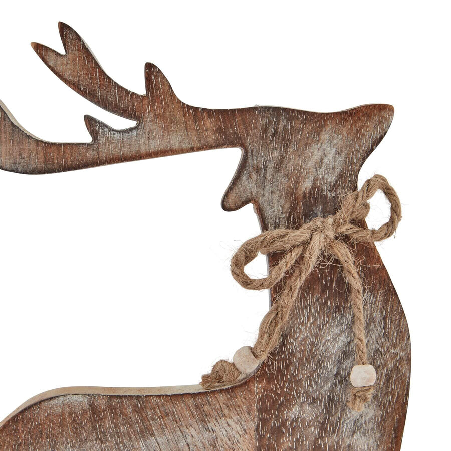 Handcrafted white-washed wooden reindeer decor with Scandinavian design, geometric silhouette, and rustic distressed finish. by Sostter at brixbailey.com
