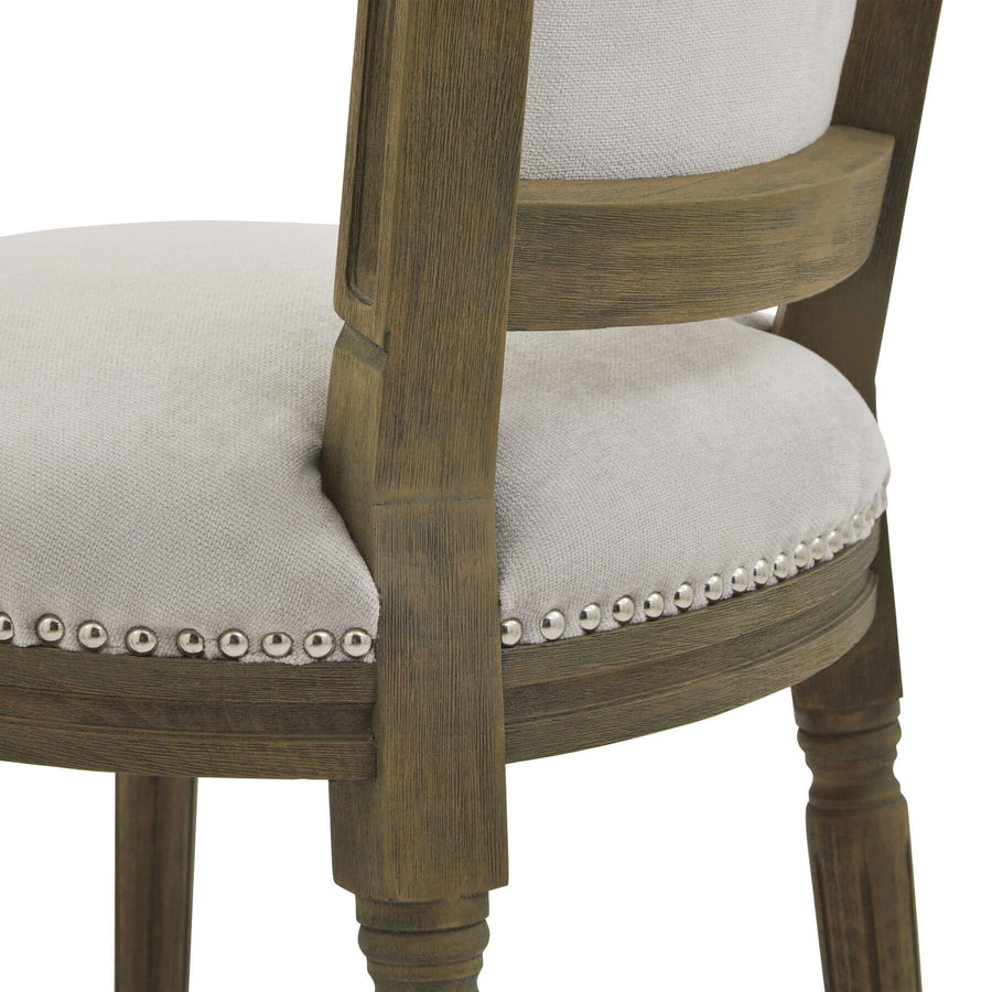 Grey upholstered Ripley dining chair with handcarved rubberwood frame and ergonomic design by Sostter at brixbailey.com