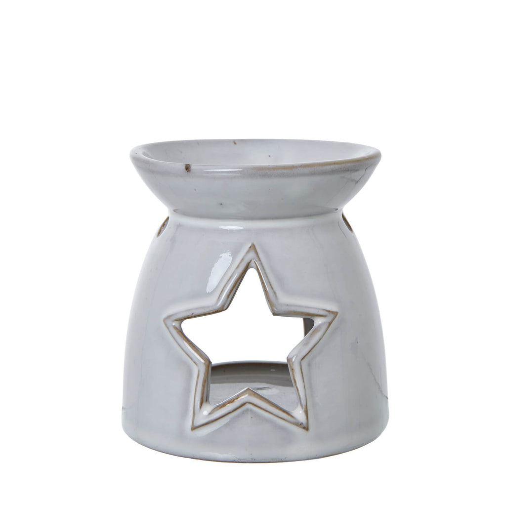 White ceramic tealight holder with star cut-outs, casting enchanting light patterns for home decor   

- **Keywords included:** white ceramic, tealight holder, star cut-outs, light patterns, home decor  
- **Clear description:** Visually describes the product and its key decorative feature  
- **SEO & accessibility optimized:** Concise yet informative for both search engines and screen readers by sostter at brixbailey.com