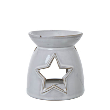 White ceramic tealight holder with star cut-outs, casting enchanting light patterns for home decor   

- **Keywords included:** white ceramic, tealight holder, star cut-outs, light patterns, home decor  
- **Clear description:** Visually describes the product and its key decorative feature  
- **SEO & accessibility optimized:** Concise yet informative for both search engines and screen readers by Sostter at brixbailey.com