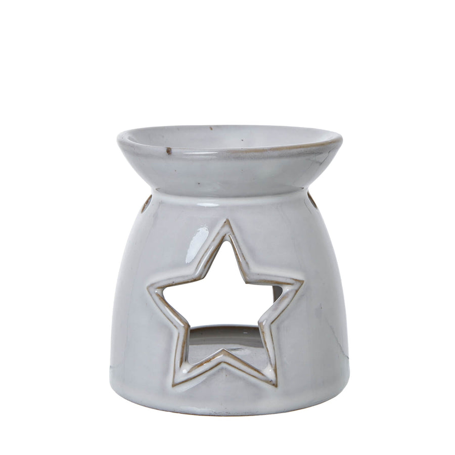 White ceramic tealight holder with star cut-outs, casting enchanting light patterns for home decor   

- **Keywords included:** white ceramic, tealight holder, star cut-outs, light patterns, home decor  
- **Clear description:** Visually describes the product and its key decorative feature  
- **SEO & accessibility optimized:** Concise yet informative for both search engines and screen readers by Sostter at brixbailey.com