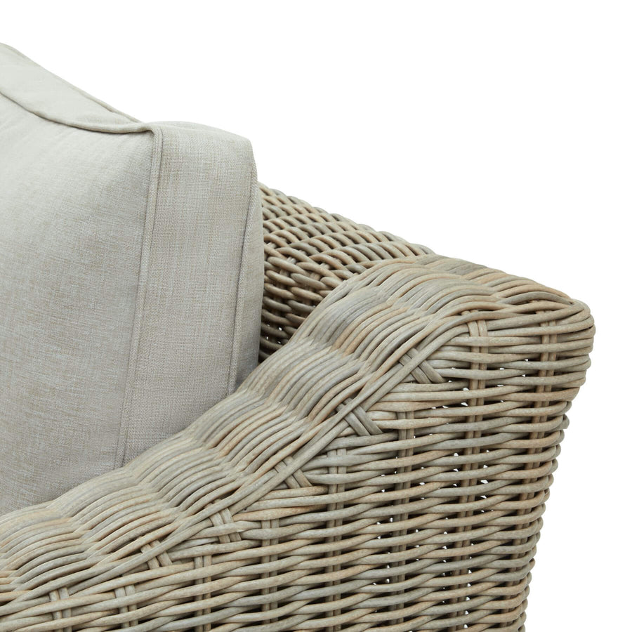 Beige outdoor two-seater sofa with HDPE wicker weave, aluminum frame, and acacia wood feet by Sostter at brixbailey.com