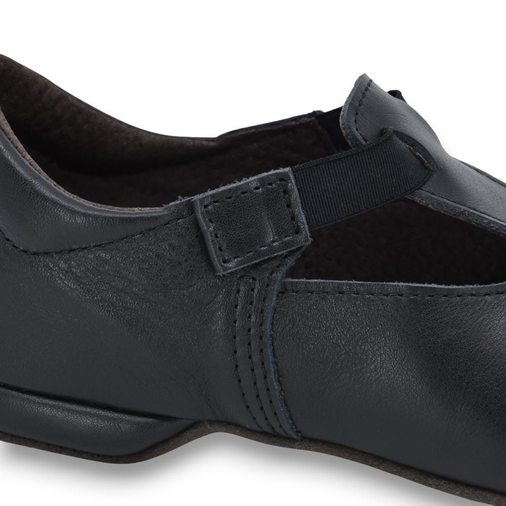 soft leather dance slippers kergatsi with cushioned insole and 1cm heel, resting on a cozy textile bag