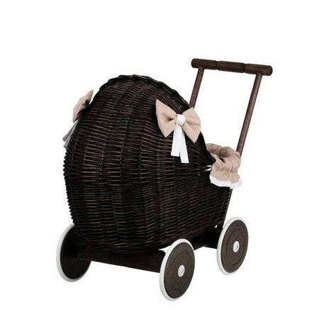 a close-up detail of the elegant dark wicker pram's hand-woven texture and soft beige bedding