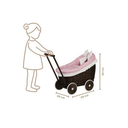 a close-up detail shot of the dark wicker pram's cozy pink bedding and mattress