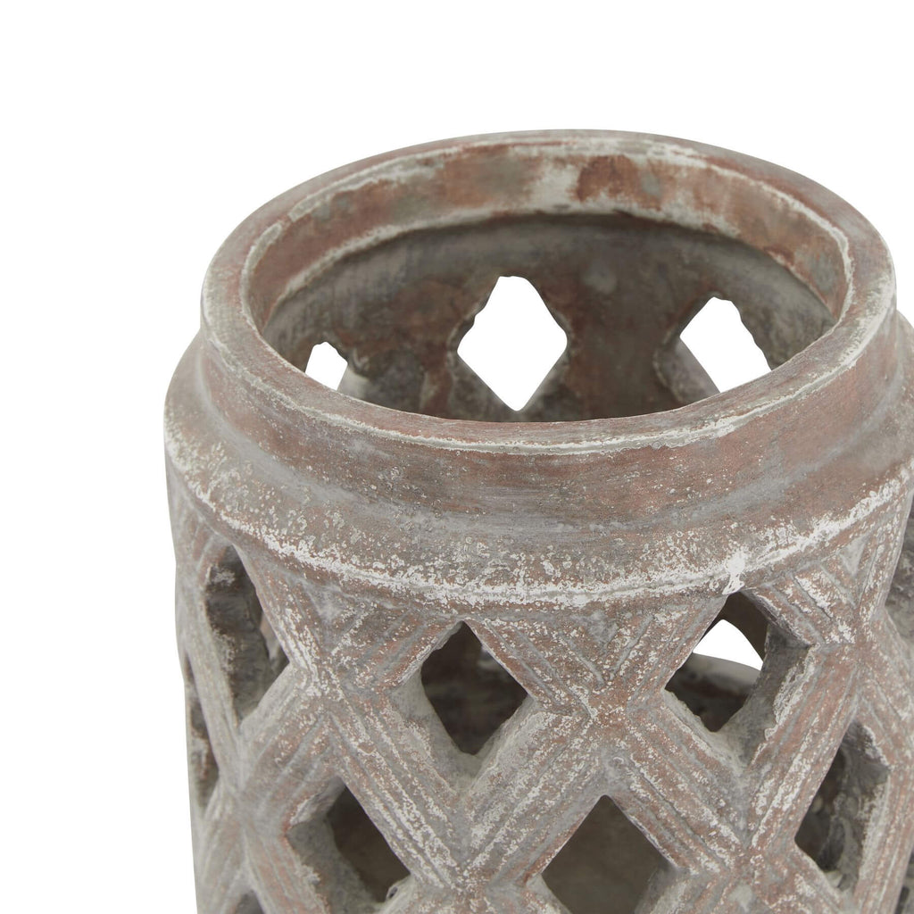 Brown ceramic lattice lantern with geometric cutouts casting intricate light patterns, modern home decor centerpiece by Sostter at brixbailey.com