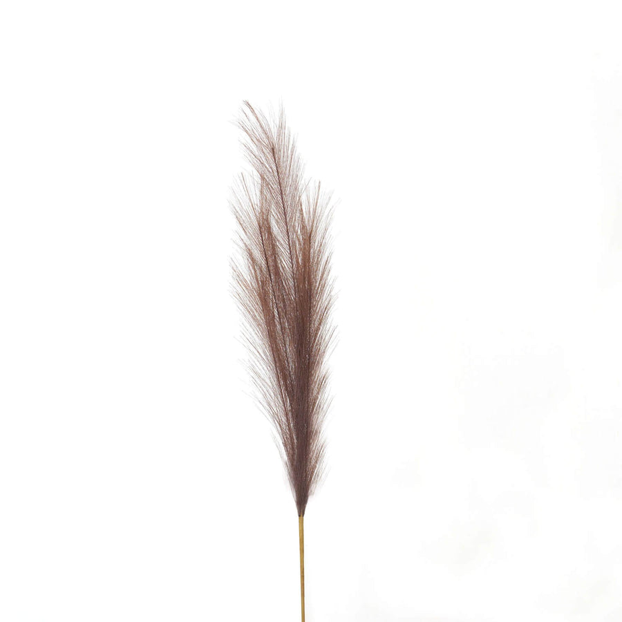 Lifelike taupe faux pampas grass plume, 85cm tall with feathery texture, perfect for boho or modern home decor by Sostter at brixbailey.com