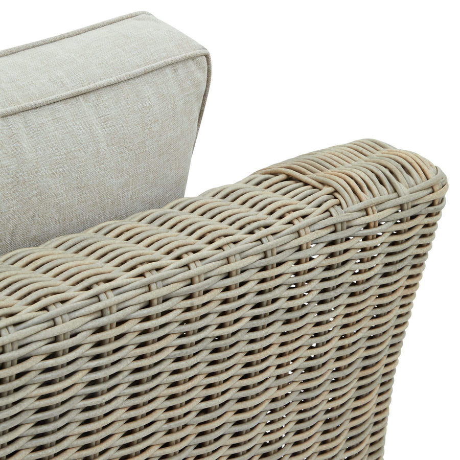 Premium beige outdoor armchair with HDPE wicker weave, aluminum frame, and acacia wood feet for all-weather durability. by Sostter at brixbailey.com