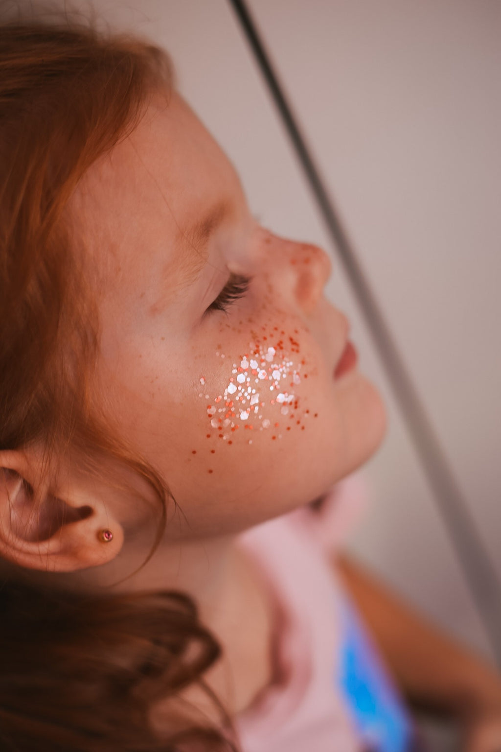 bold close-up of sparkling pink biodegradable star dust glitter in a glass jar