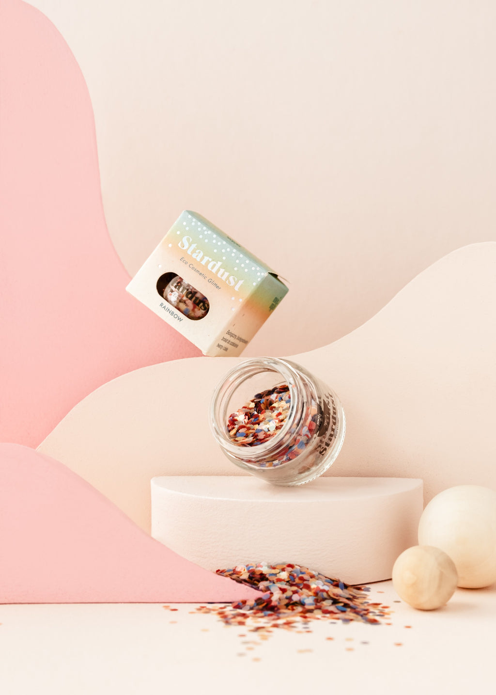functional glass jar of rainbow star dust eco glitter on a craft table