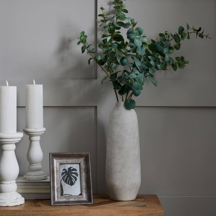 Handcrafted stoneware vase with matte stone finish, textured surface, and neutral hue for modern or traditional decor. by Sostter at brixbailey.com