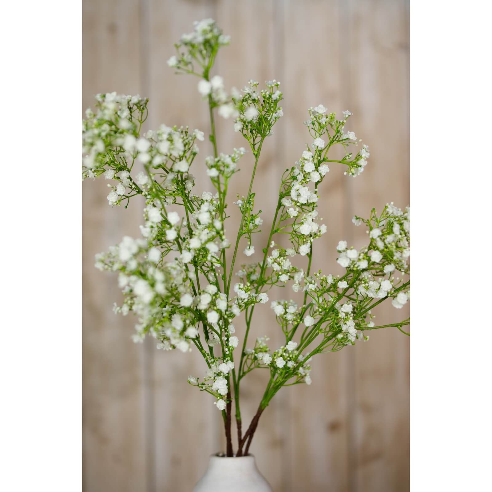 Cream gypsophila spray with lifelike blooms, 42-inch plastic stems, for elegant home decor or floral arrangements by Sostter at brixbailey.com