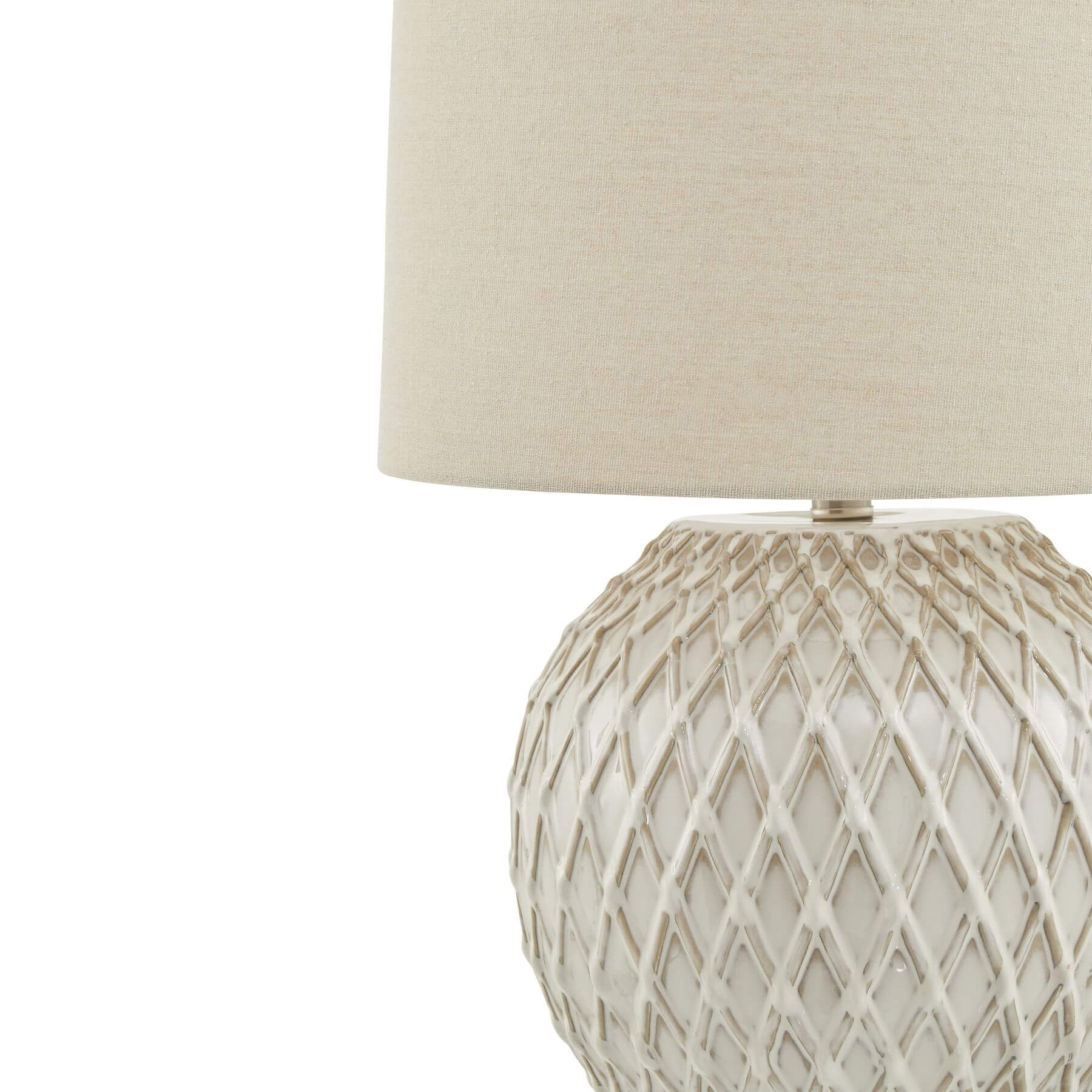 Handcrafted white ceramic lattice table lamp with linen shade, casting warm ambient light for modern or traditional decor by RoomLondon at brixbailey.com