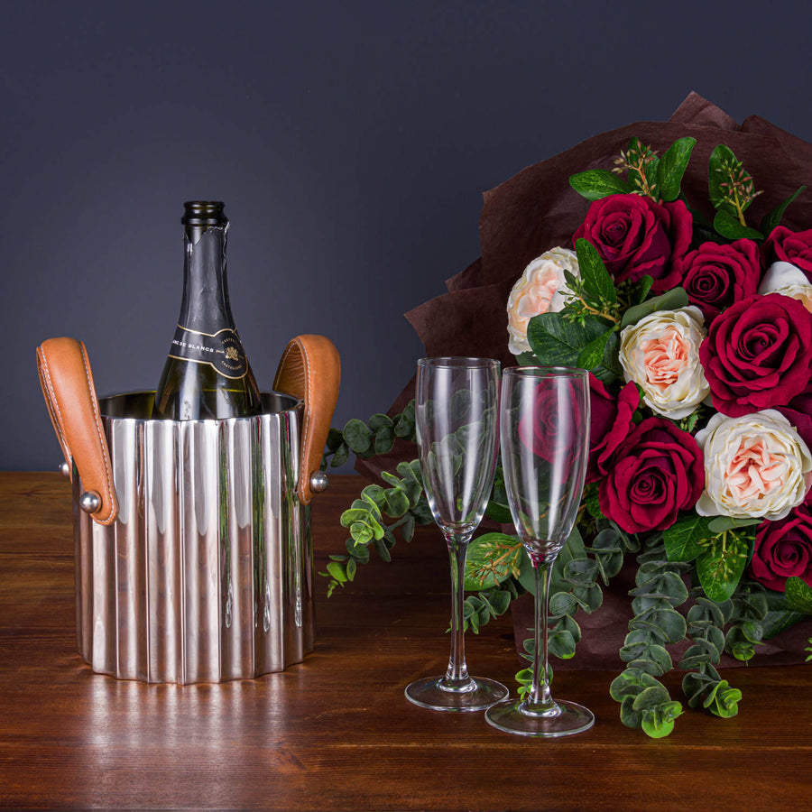 Silver fluted champagne cooler with leather handles, stainless steel, elegant ridges for light reflection, versatile centerpiece by Sostter at brixbailey.com