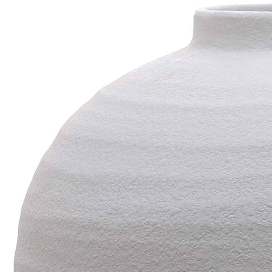 Matte white ceramic vase with textured grooves, perfect for floral arrangements in modern interiors. by Sostter at brixbailey.com