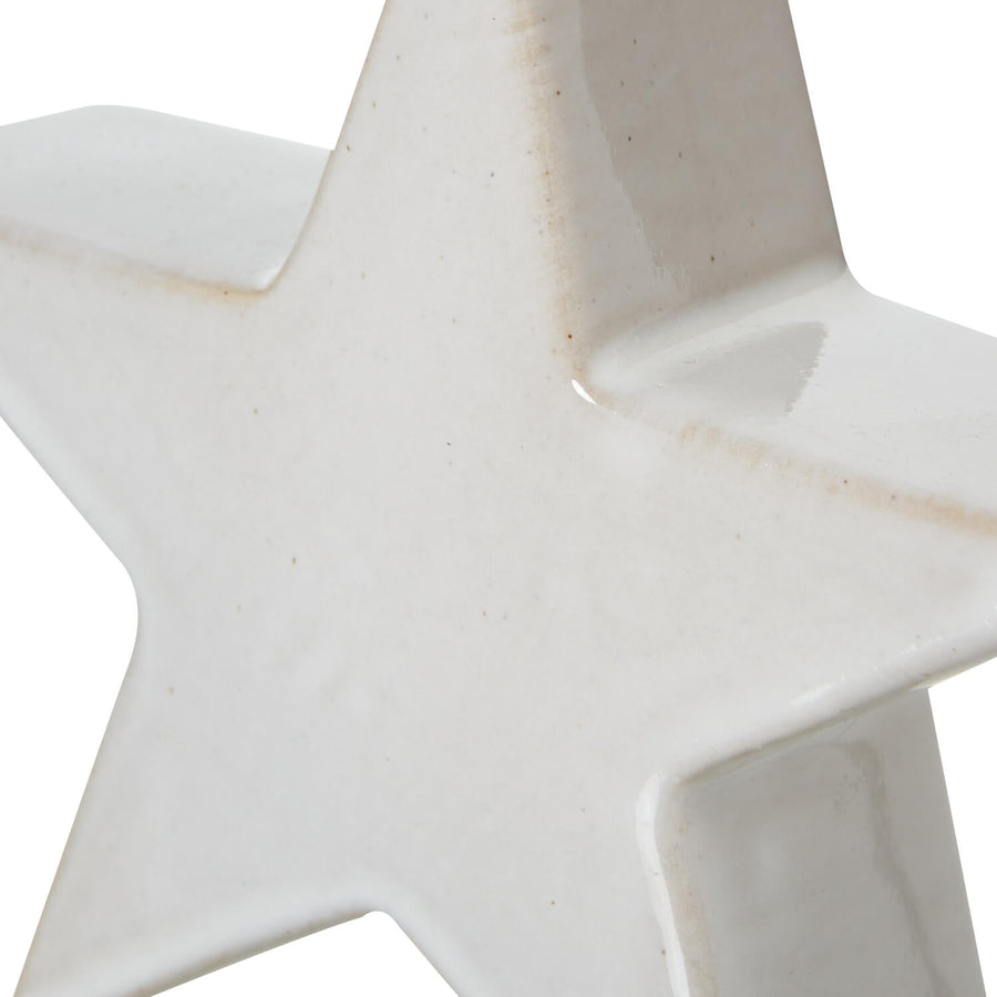 Handcrafted white ceramic star decor with minimalist design, casting enchanting light shadows, 12cm H. by Sostter at brixbailey.com