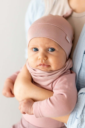 confident baby in a stylish bamboo sun hat with an adjustable knot, bold and protected
