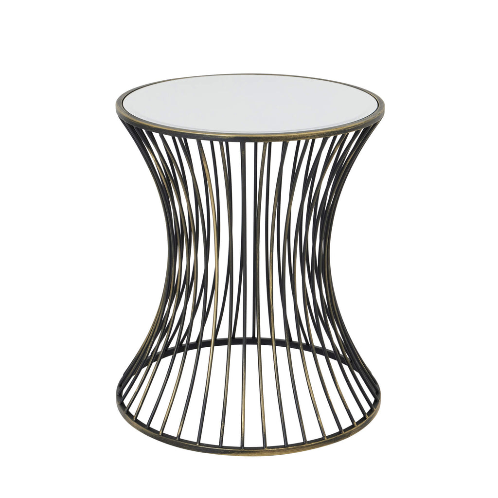 Handcrafted brass side table with black patina finish, concave silhouette, and mirrored glass surface for modern interiors. by Sostter at brixbailey.com