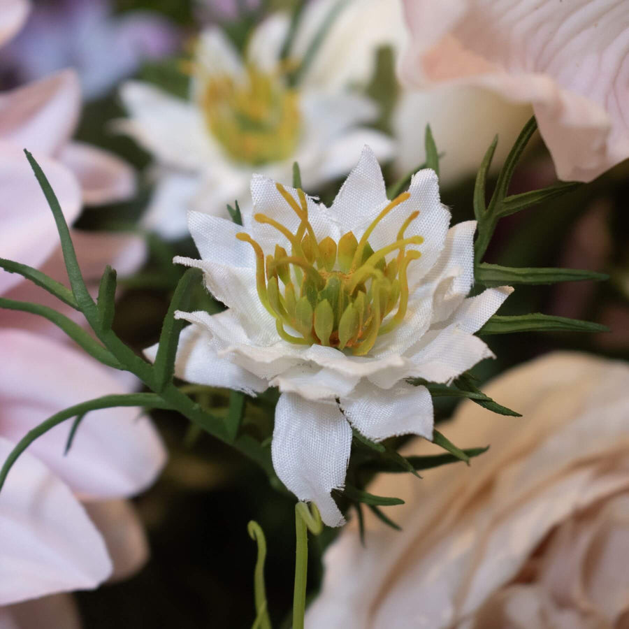 White Nigella floral stem with intricate seed pods and feathery foliage for elegant home decor or wedding arrangements. by Sostter at brixbailey.com