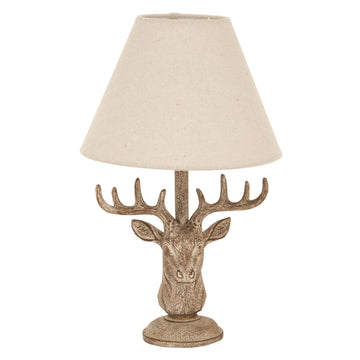 Handcrafted stag head table lamp with stonewashed resin base and natural linen shade in rich brown. by Sostter at brixbailey.com