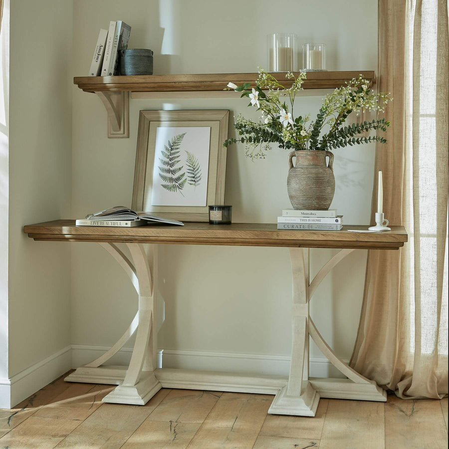 Handcrafted pine console table with mid-tone stain and white base, blending rustic wood grain with modern farmhouse style. by Sostter at brixbailey.com